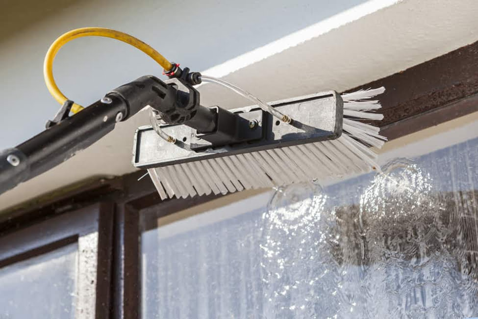 Window and Frame Being Cleaned